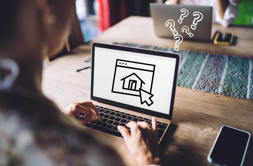 Need A Website News A person types on a laptop, displaying a home icon on the screen, surrounded by question marks, suggesting confusion or inquiry.