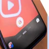 Close-up of a smartphone screen displaying a video app interface with options for 'Story,' 'Reel,' and 'Live' highlighted.