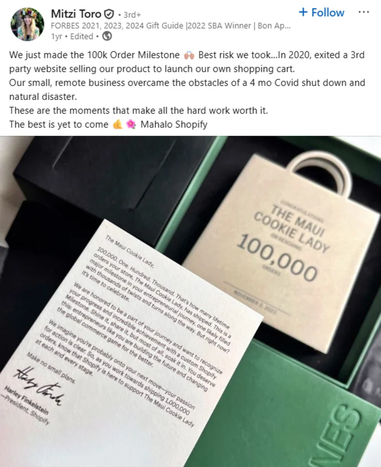 A milestone award celebrating 100,000 orders for The Maui Cookie Lady, showcasing achievements and gratitude towards Shopify.