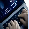 A person types on a laptop keyboard with a dark screen displaying "AI" and a search bar, suggesting an interaction with artificial intelligence.