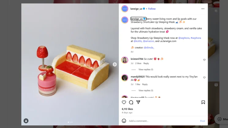 A whimsical display featuring a strawberry cake sofa and Laneige lip mask, styled with vibrant strawberries and cream details.