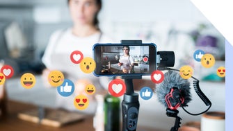 A smartphone on a gimbal captures a video in a kitchen, surrounded by animated social media reaction icons.