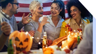Group of people in fancy dress celebrating at a Halloween party
