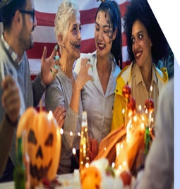 Group of people in fancy dress celebrating at a Halloween party