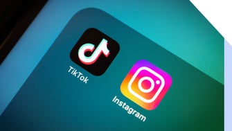 close up of iPhone app folder with TikTok and Instagram in it