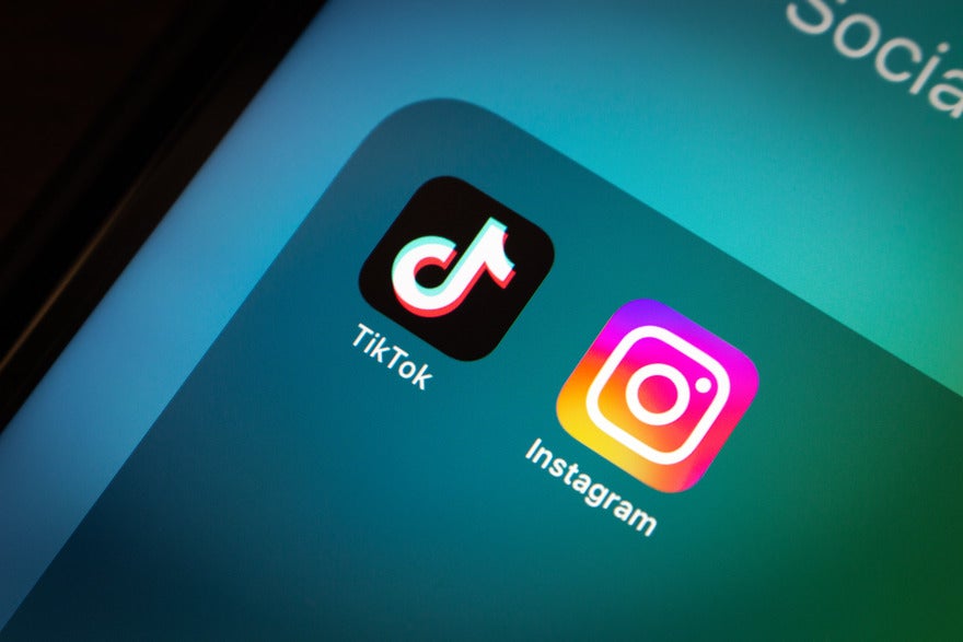 close up of iPhone app folder with TikTok and Instagram in it