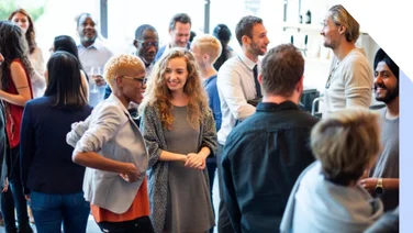 Group of people mingling and networking at an event
