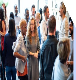 Group of people mingling and networking at an event