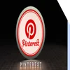 Illuminated Pinterest logo on a dark background, featuring a red circular design with the name "Pinterest" below in bold letters.