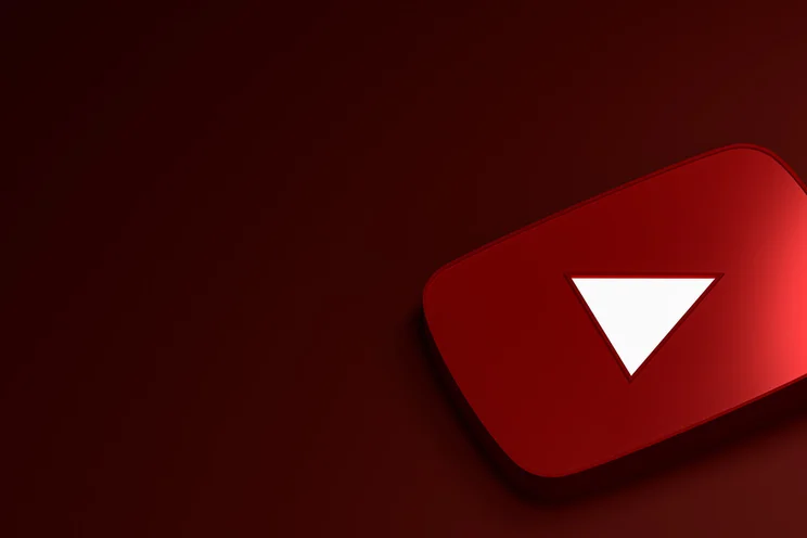 A red YouTube play button with a white triangle on a dark red background.