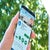 A person holding a smartphone displaying the 