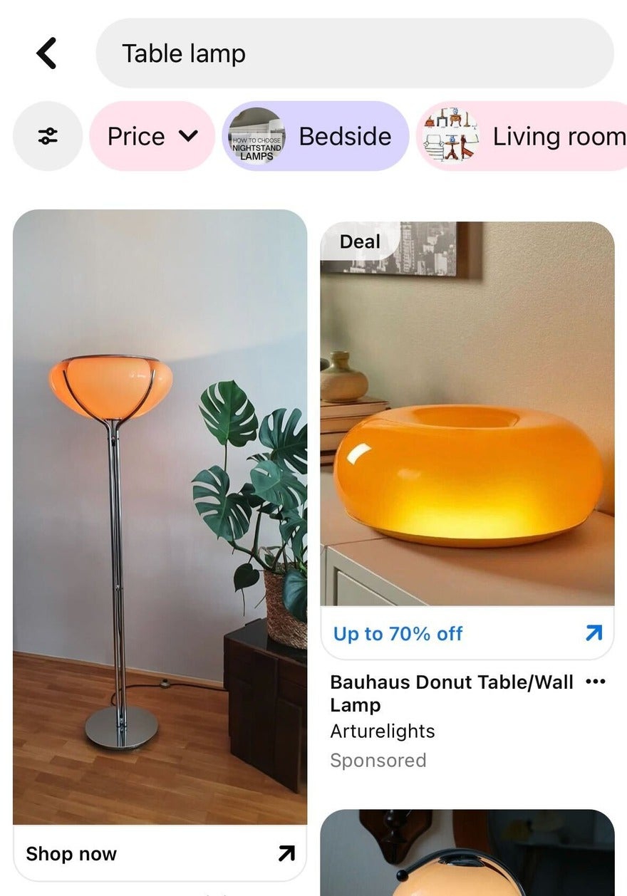 Pinterest Promotion Deals Pinterest search for the term "table lamp" showing ads of a stylish floor lamp with a round, orange shade next to a modern donut-shaped table lamp, both glowing softly.