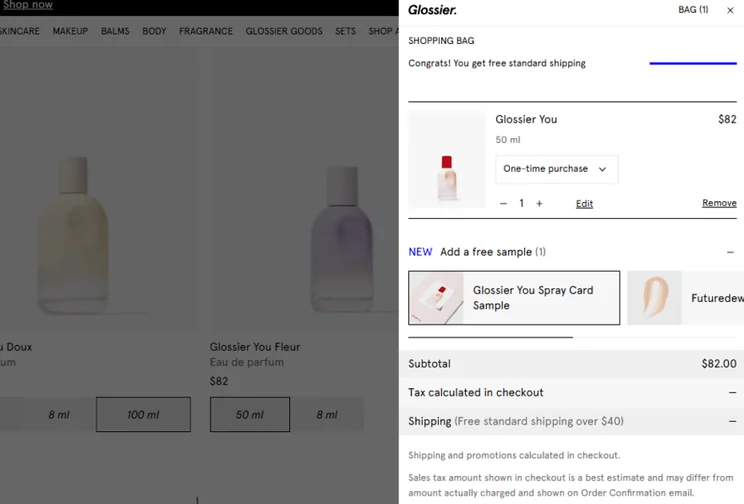 Glossier pop up cart showing products and checkout cost, including a note that the user has qualified for free shipping