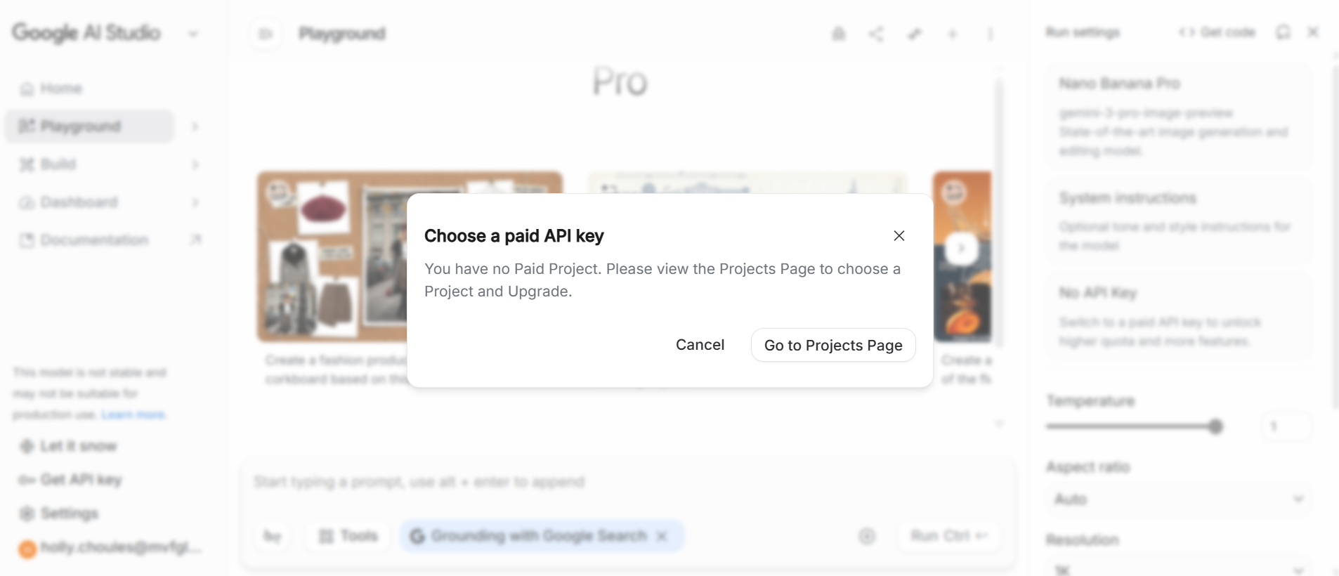 Popup message on Google AI Studio indicating no paid API key is available, with options to cancel or go to the Projects Page.